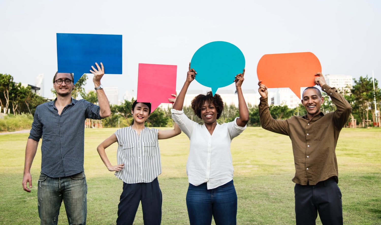 people holding up speech signs