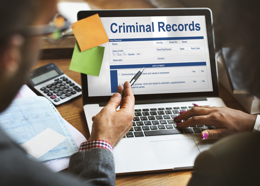 laptop showing criminal record